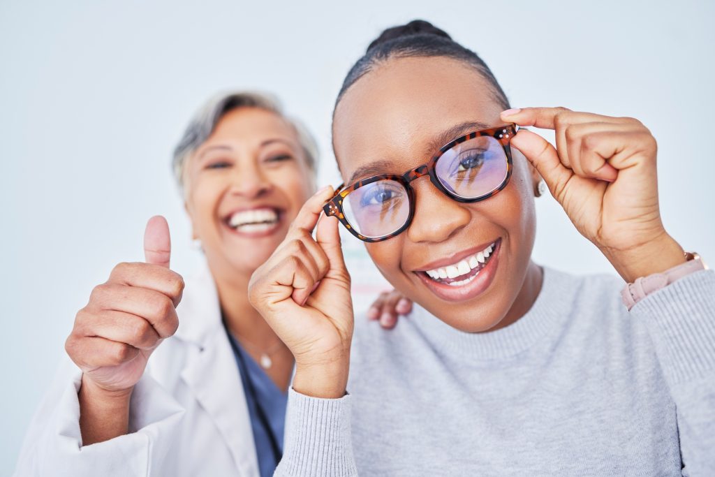 Eye care, glasses and patient with doctor, women at clinic, optometry and frame choice with help an